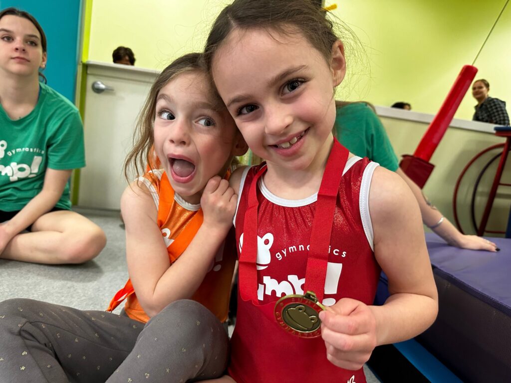 Young Gymnasts Cheering Each Other On