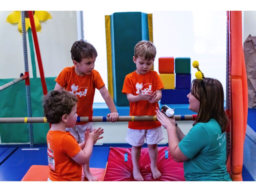 Young Gymnasts focusing on their coach