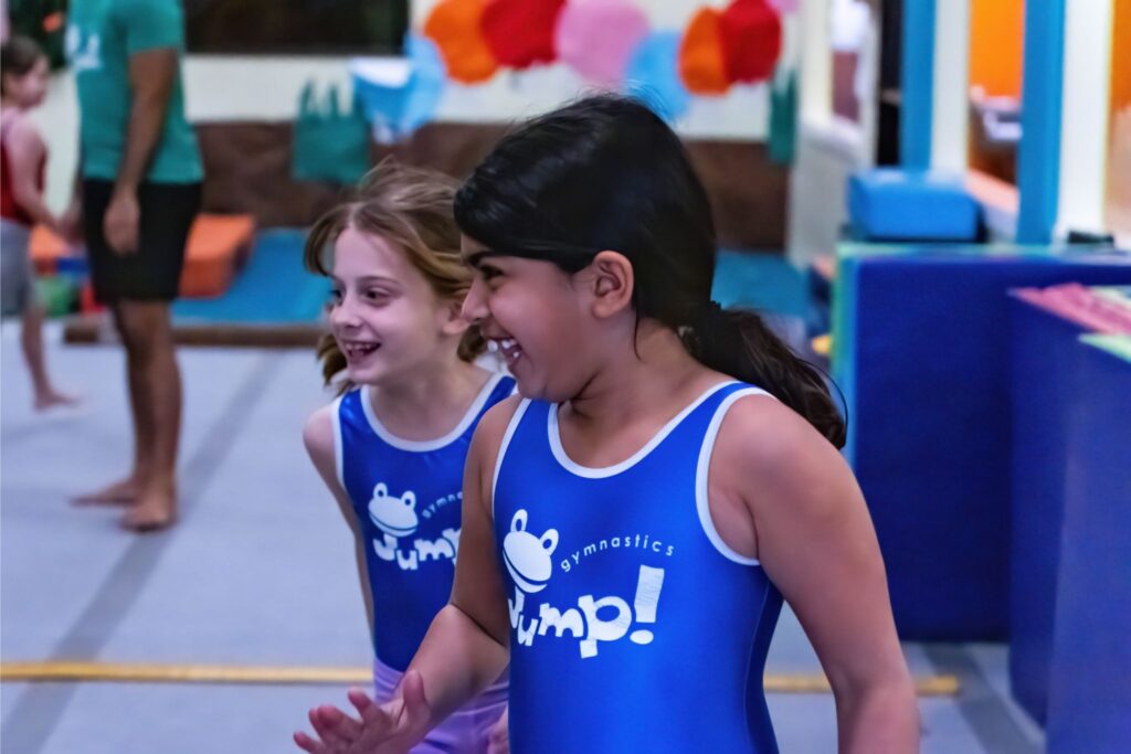 Young Gymnasts Playing at Gymnastics